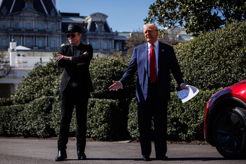 US President Trump views Tesla vehilces in front of the White House